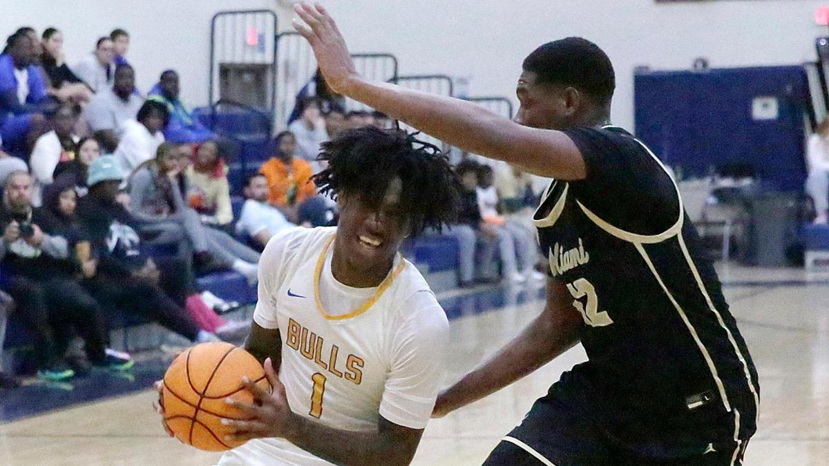 Northwestern Calvin Russell Jr. (1) controls the ball during the GMAC Boys’ basketball championship game against Miami Senior High Saturday, January 25, 2025 at Miami Senior HS in Miami.