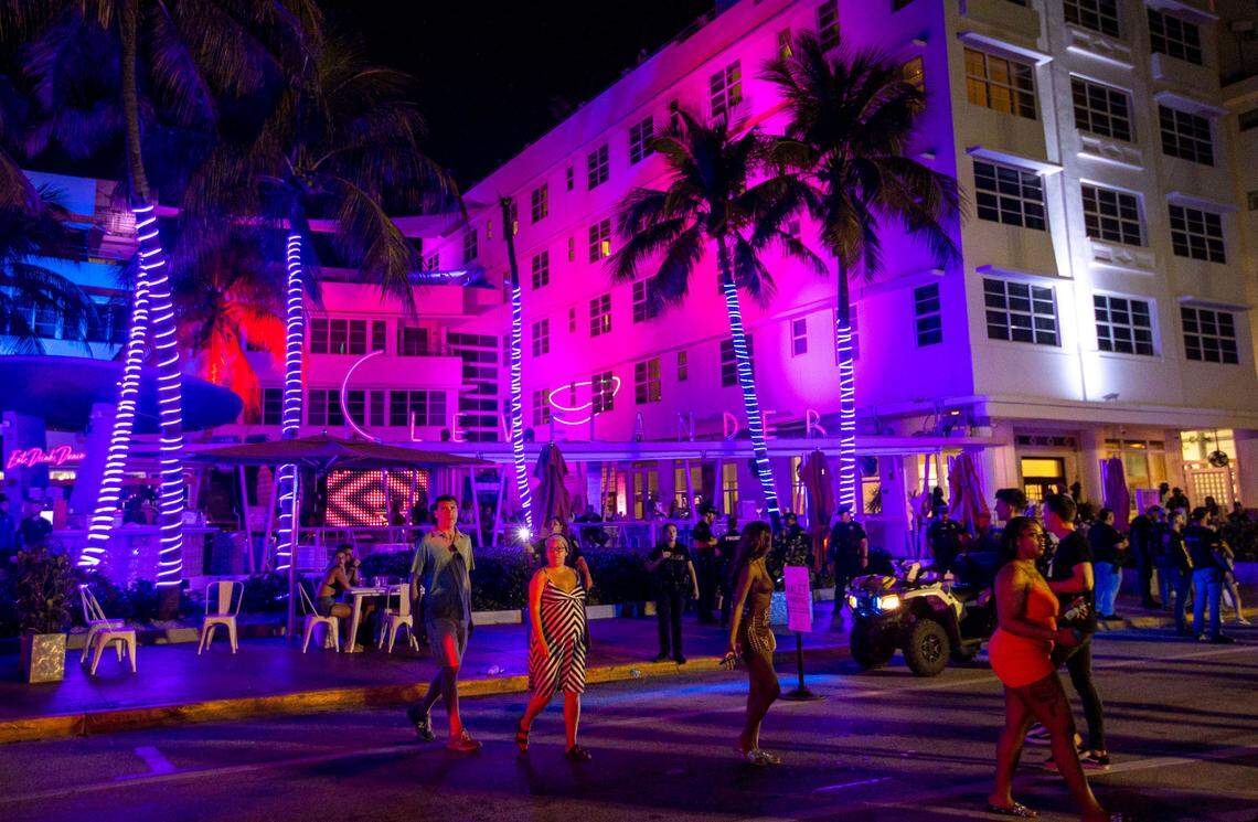 People fill the streets in front of the Clevelander during spring break in Miami Beach, Florida, on Saturday, March 19, 2022.