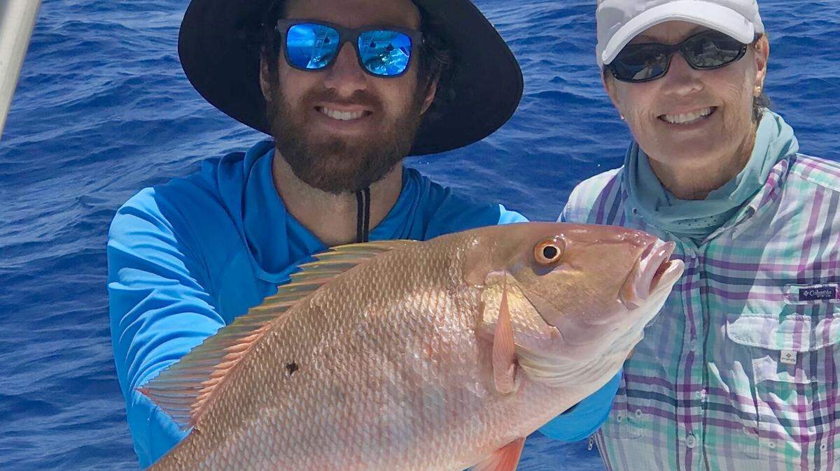 Capt. Abie Raymond holds a nice mutton snapper caught by a client fishing on Bouncer’s Dusky 33 with Capt. Bouncer Smith. Muttons eat live ballyhoo and shrimp around patch reefs in November.