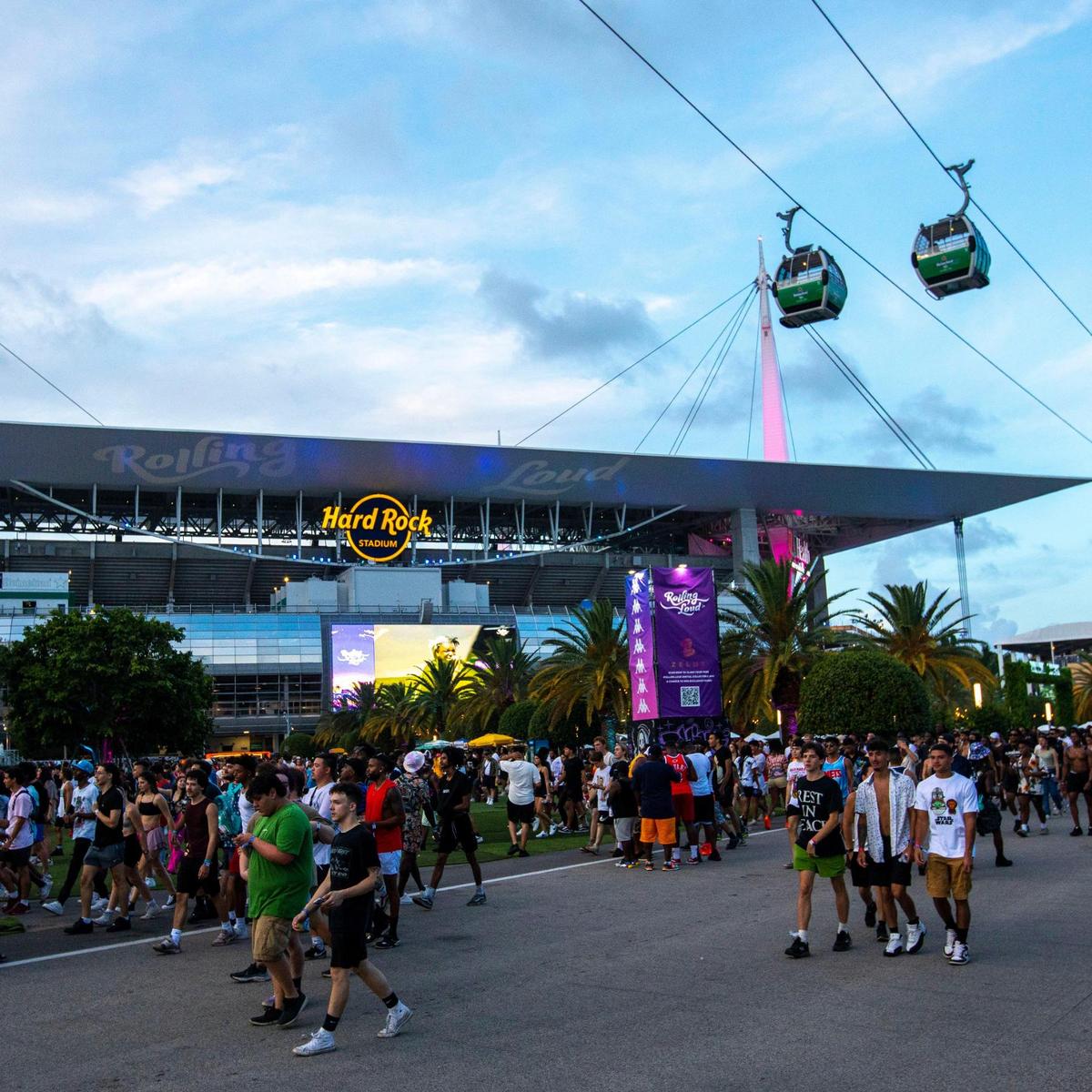 Festival goers walk the grounds during the first day of Rolling Loud Miami, an international hip-hop festival, at Hard Rock Stadium in Miami Gardens, Florida, on Friday, July 22, 2022.