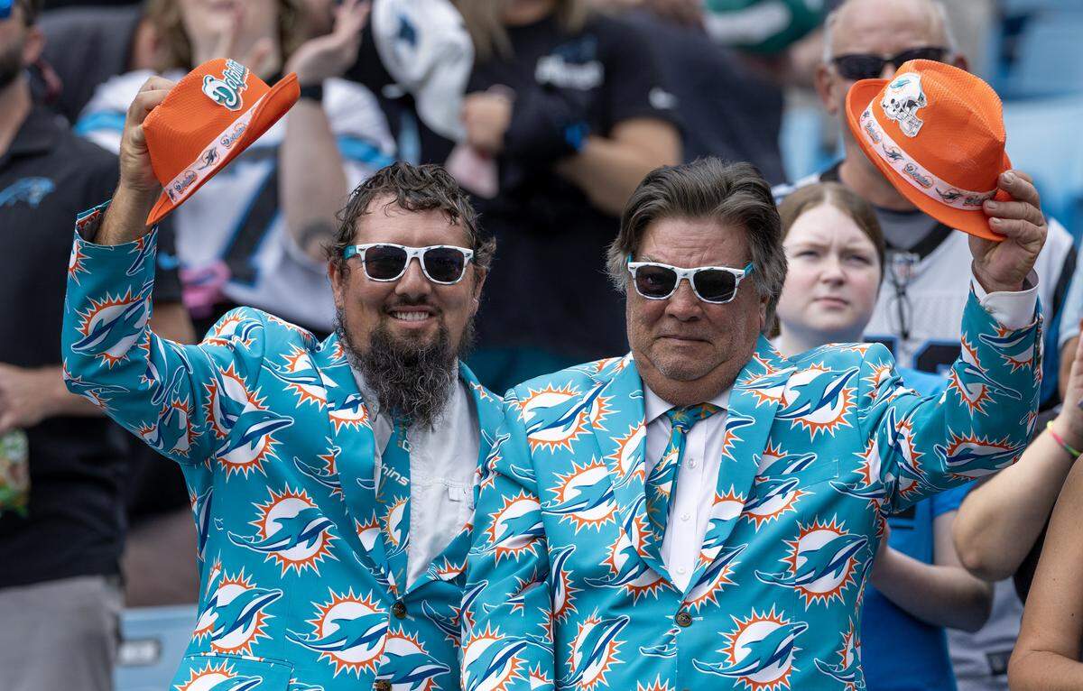 Miami Dolphins fans show their support before their NFL football game against the Carolina Panthers at Bank of America Stadium on Sunday, Oct. 5, 2025, in Charlotte, N.C. 