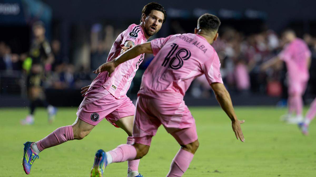 Inter Miami forward Lionel Messi (10) celebrates with teammate Jordi Alba (18) after scoring against Los Angeles FC during the first half of the Concacaf Champions Cup quarterfinal second leg at Chase Stadium on Wednesday, April 9, 2025, in Fort Lauderdale, Fla.