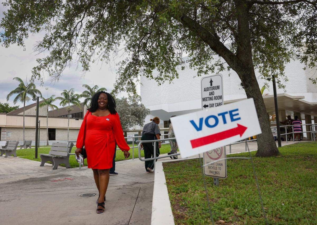 Daniella Pierre walks out after voting during the last day of Early Voting on Sunday, Aug. 18, 2024, at the Jospeh Caleb Center in Miami. “It is my responsibly for my community and my future, and I also brought others from church to come vote,” said Pierre. The poll worker said that this has been their busiest day of early voting.
