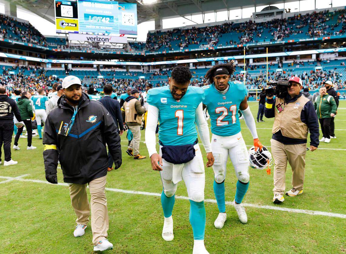 Miami Dolphins quarterback Tua Tagovailoa (1) walks off field after Green Bay Packers defeat the Dolphins 26-20 in an NFL game at Hard Rock Stadium on Sunday, December 25, 2022.