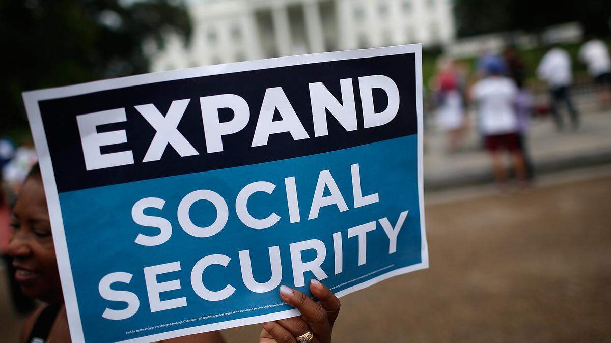 In 2015, activists participate in a rally in front of the White House urging the expansion of Social Security benefits.