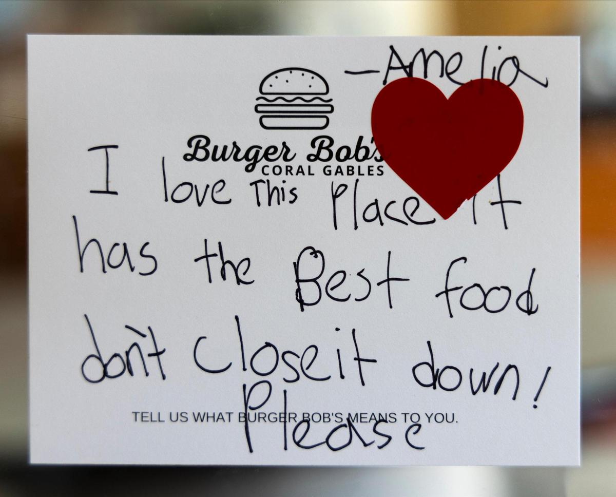 A small sign of support from a young patron is taped to the glass window of Burger Bob’s on Monday, Dec. 20, 2021.