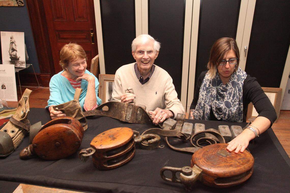 Retired Florida Sen. Richard Renick of Miami, center, his wife Valerie, left, and Key West Art & Historical Society Curator Cori Convertito examine artifacts and memorabilia donated by Renick to The Society on Jan. 8, 2018. Along with the wooden ship’s blocks, vintage diver’s weight belt and canvas/brass diving boot pictured here, are a section of Flagler’s railroad track that Renick recovered on a dive four decades earlier. “I want to share these things I’ve enjoyed with the public,” Renick said at the time.