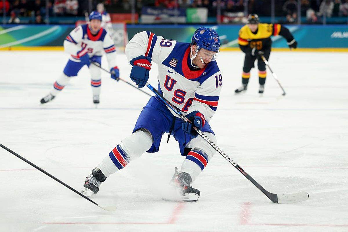 MILAN, ITALY - FEBRUARY 15: Matthew Tkachuk #19 of Team United States controls the puck in the second period during the Men's Preliminary Group C match between the United States and Germany on day nine of the Milano Cortina 2026 Winter Olympic games at Milano Santagiulia Ice Hockey Arena on February 15, 2026 in Milan, Italy. (Photo by Gregory Shamus/Getty Images)