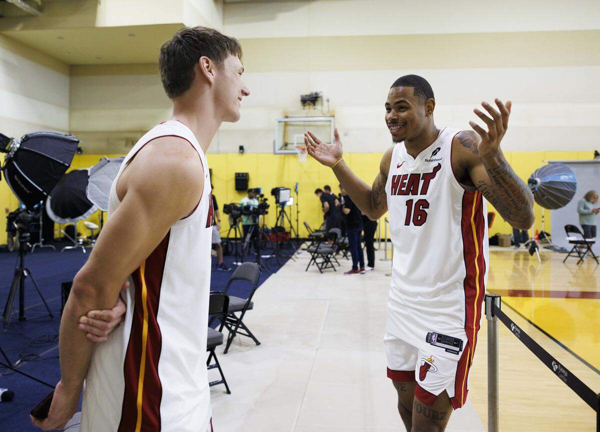 Pelle Larsson (9) and Keshad Johnson (16) joke around while they wait to be interviewed during the Miami HEAT Media Day on Monday, Sept. 29, 2025, at the Kaseya Center in downtown Miami, Fla. 