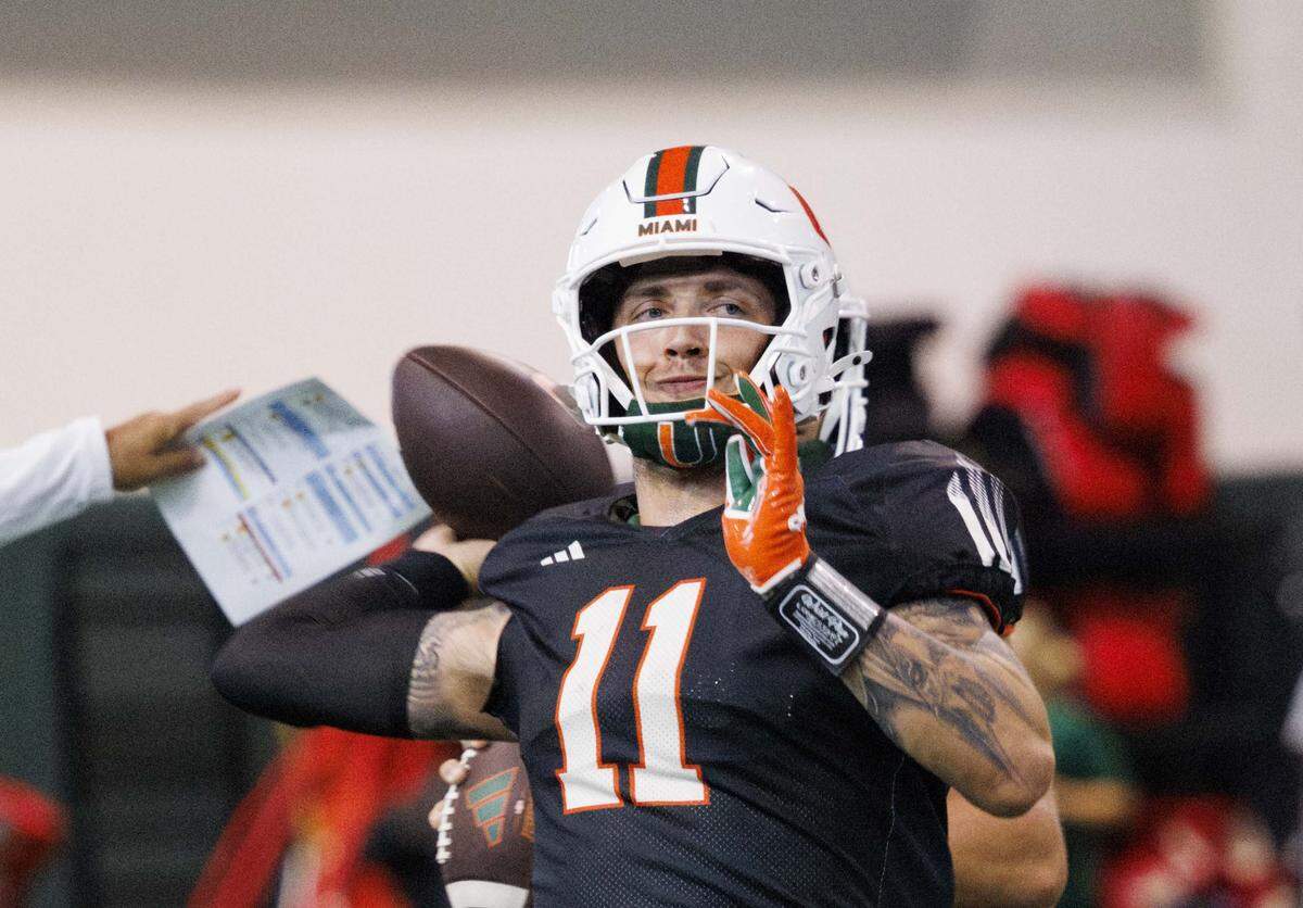 Quarterback Carson Beck (11) throws the ball during Miami Hurricanes football practice on Wednesday, Aug. 6, 2025, at University of Miami in Coral Gables, Fla. 