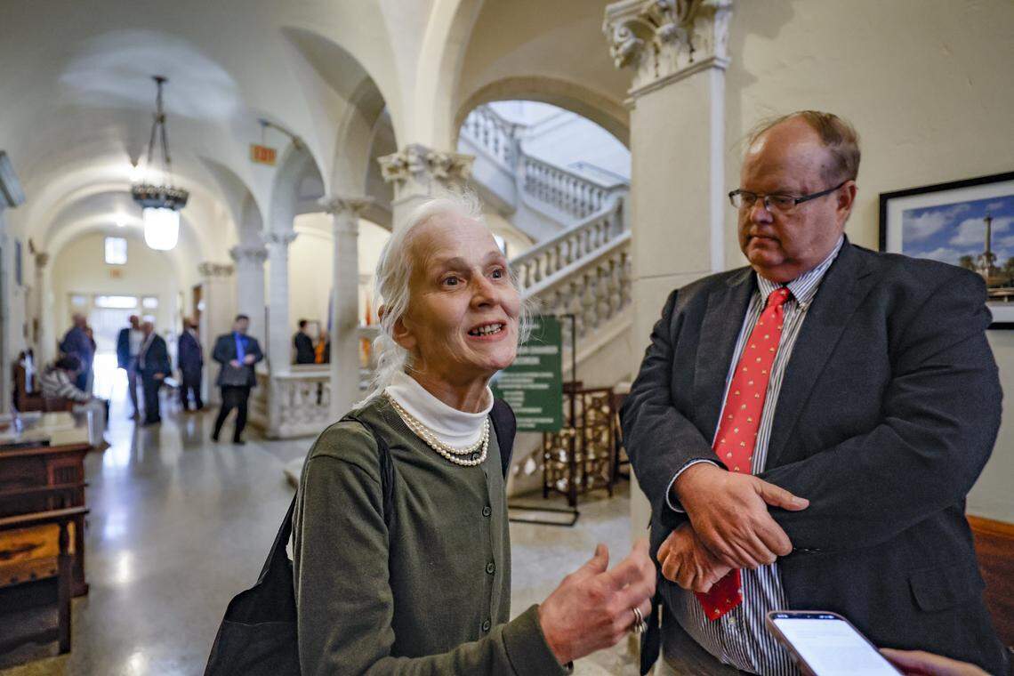 Coral Gables city resident Bonnie Bolton and her attorney David Winker speak to reporters after the commission votes on development plans at 110 Phoenetia Ave at the site of the "Garden of Our Lord" and an ancient tree that is believed to be at least as the century old City of Coral Gables, Florida on Tuesday, February 10, 2026.