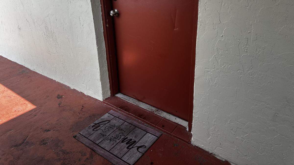 Blood left behind on the doorstep of apartment 408 after Stephen McKenzie shot and killed Julie Cruz, 32, and their two children Nova and Emery McKenzie, both 2 years old, at an apartment complex in Pembroke Park, near Hallandale Beach. Cruz’s two other children were shot, one of whom was killed.