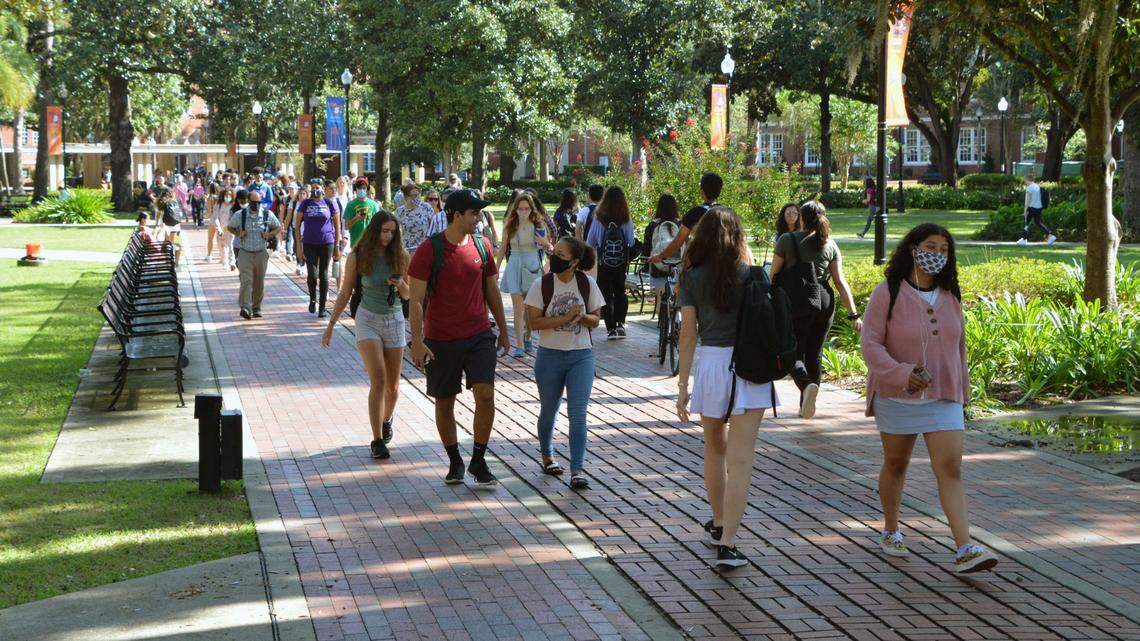 Students walk in between class periods in the Plaza of the Americas on campus, at the University of Florida in Gainesville on Sept. 22, 2021.