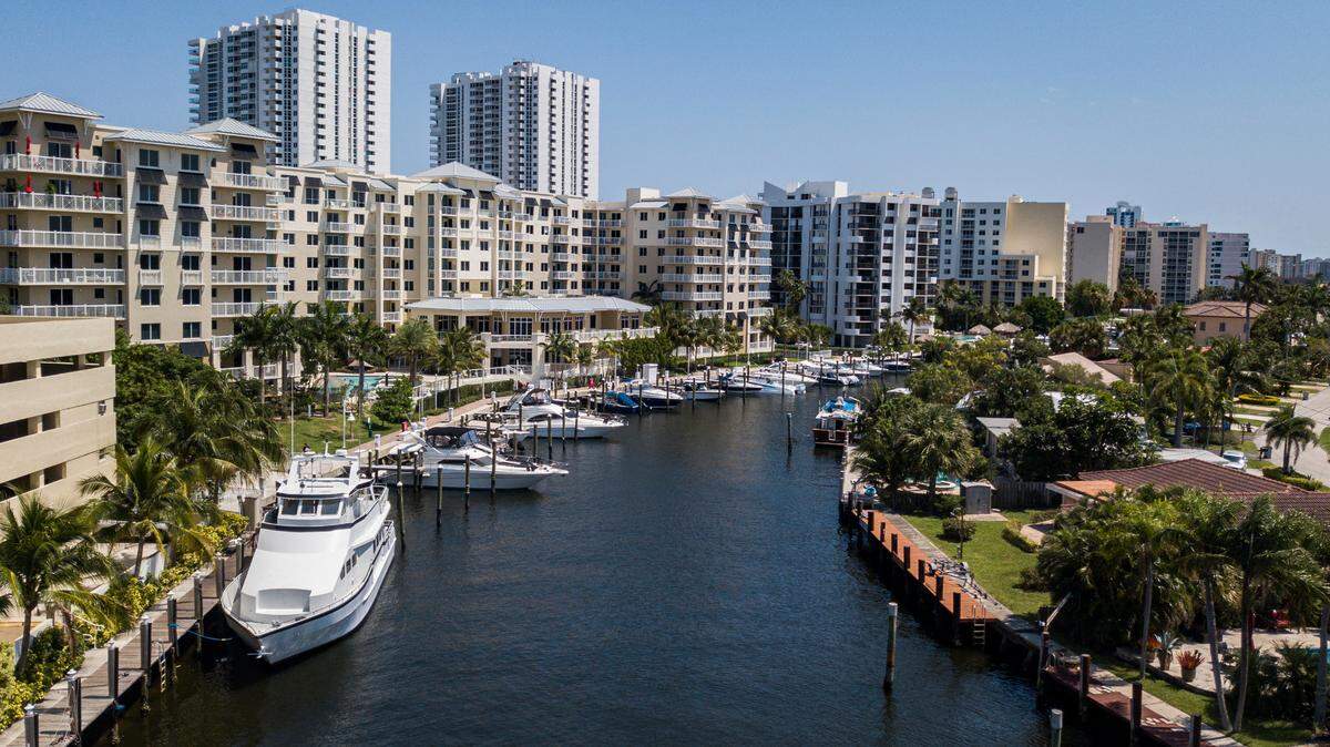 An aerial view of real estate properties off Lake Santa Barbara in Pompano Beach, Florida, in April 2021. Total South Florida home sales dropped last month compared to January 2022.