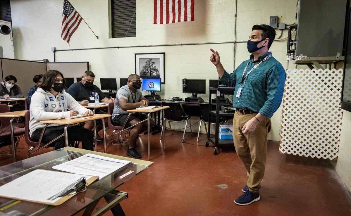 Derek Bostick, a Teacher of the Year finalist, gives instructions to his students at South Dade Technical College in Miami on January 27, 2022.