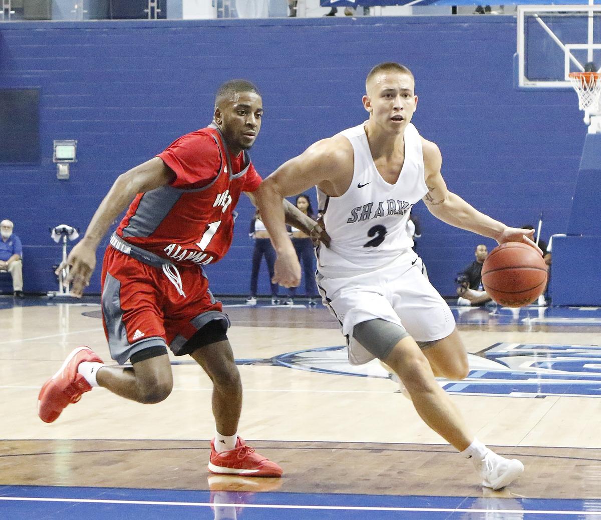 NSU Sharks’ Nick Smith (2) dribbles against West Alabama Tigers during The NCAA 2019 Division II Men’s Basketball semifinal game on Saturday, March 16, 2019 at Rick Case Arena in Fort Lauderdale