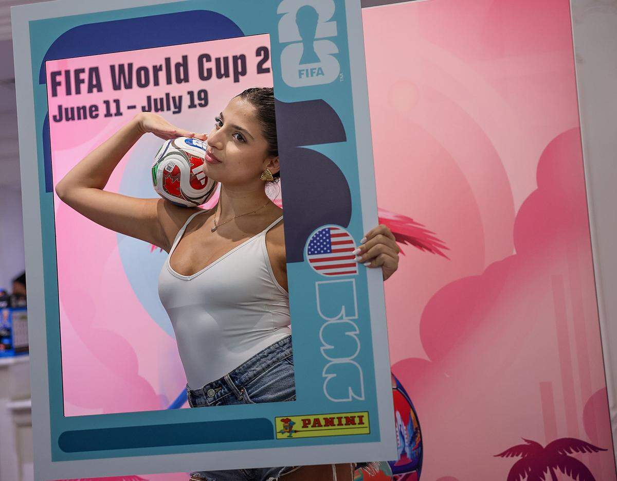 Ludmila Soleimani, 23, strikes a pose Monday at the FIFA World Cup store on Lincoln Road.