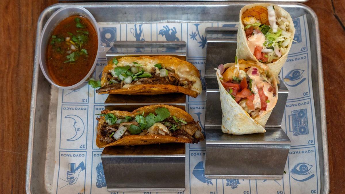 Birria tacos and shrimp tacos, two of the most popular items at Coyo Taco. Carne asada tacos are the most popular.