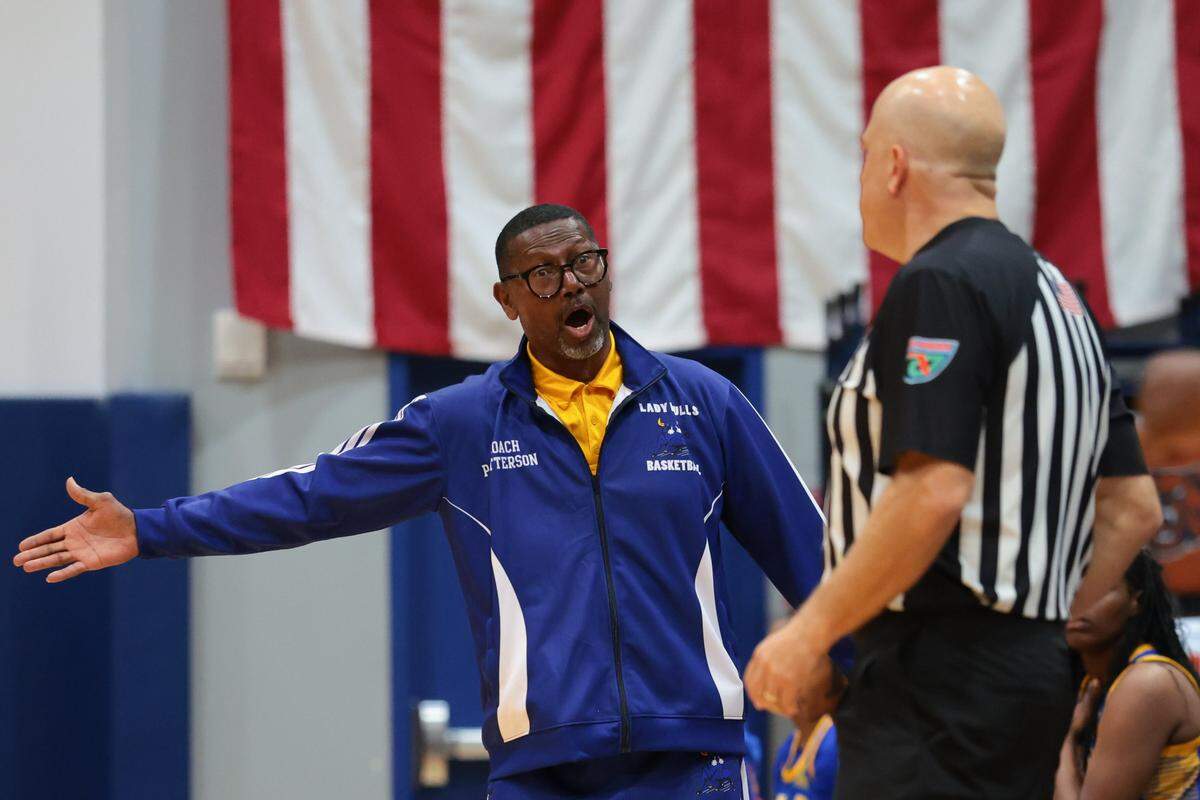 Northwestern Bulls head coach Lester Patterson reacts from the bench against the Mater Lakes Academy Bears in the third quarter during a girls' basketball Region 4-4A semifinal playoff game at Mater Lakes Academy on Friday, February, 20, 2026, in Hialeah, Fla.
