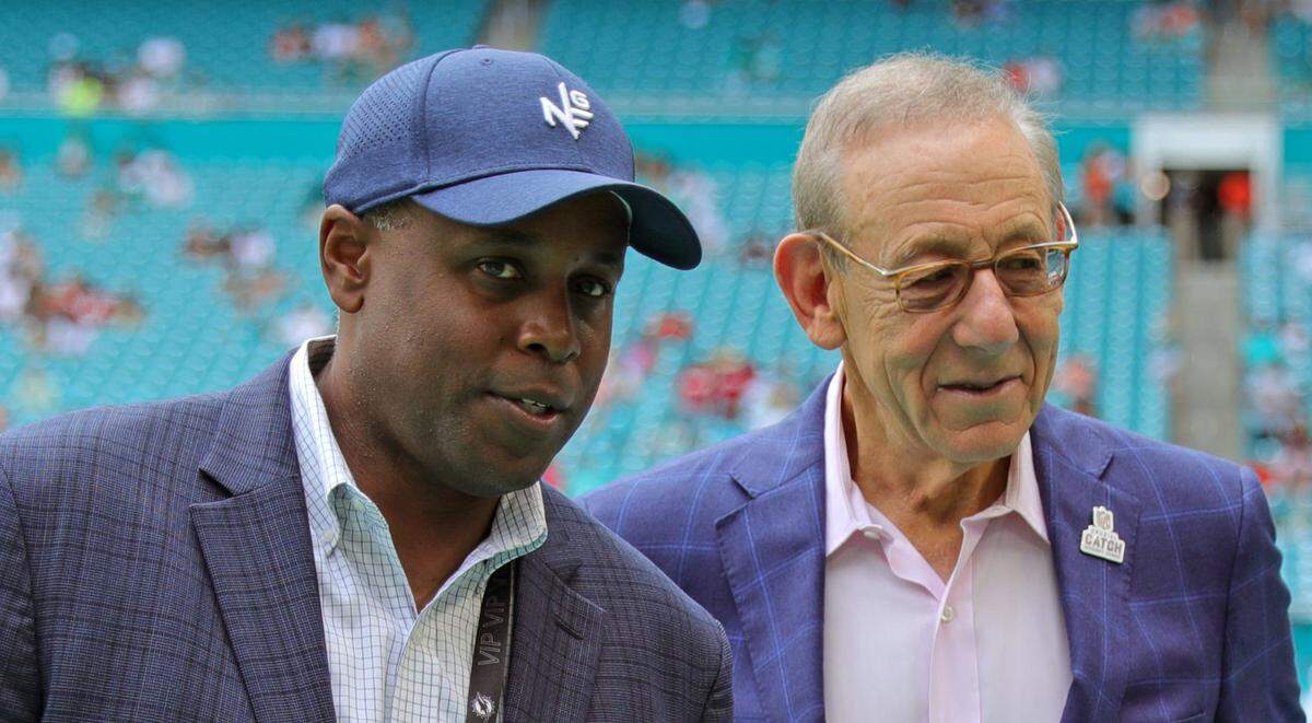 From left to right, Miami Dolphins Miami general manager Chris Grier and Dolphins owner Stephen M. Ross before the start of an NFL football game against the Atlanta Falcons at Hard Rock Stadium on Sunday, October 24, 2021 in Miami Gardens, Florida.