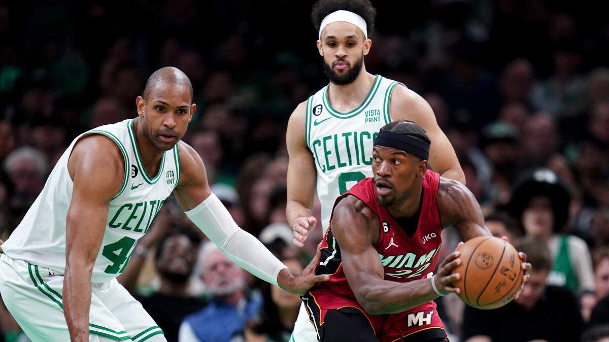 Miami Heat forward Jimmy Butler (22) looks to pass against Boston Celtics center Al Horford (42) during the first half of game two of the Eastern Conference Finals for the 2023 NBA playoffs at TD Garden.