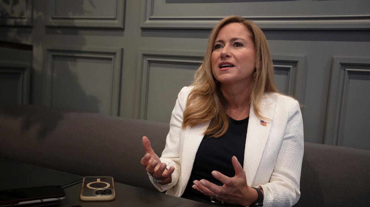 Senate candidate Debbie Mucarsel-Powell talks to a Miami Herald reporter just before her campaign event at Sanguich Coral Gables, on Sept. 22, 2024.