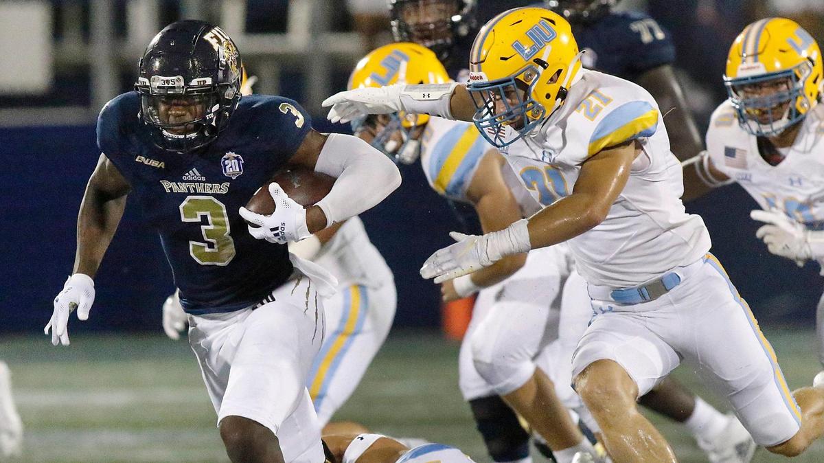 FIU Panthers running back Shaun Peterson Jr., seen here running the ball against LIU last season, is switching to play outside linebacker this season.