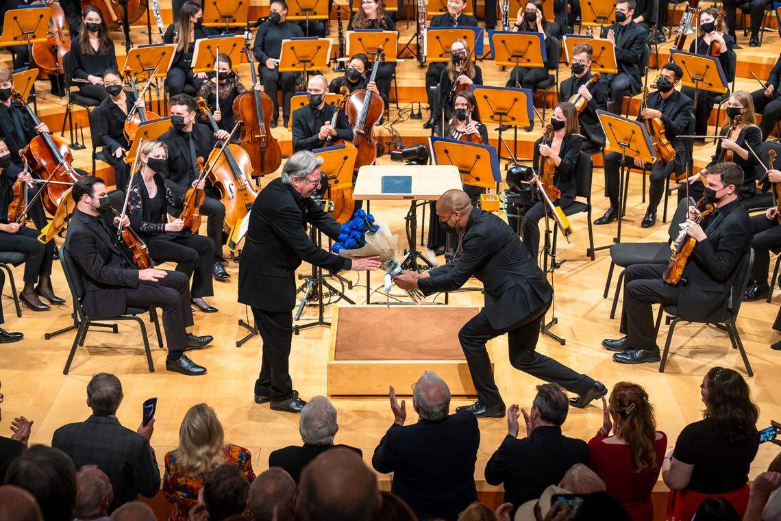 Conductor Michael Tilson Thomas is given a bouquet of flowers after performing at the New World Center on May 6, 2022. Tilson Thomas will step down as the artistic director of the New World Symphony due to health concerns.