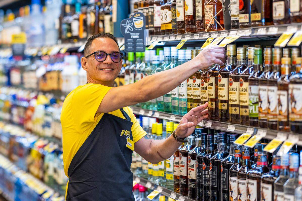  The store will be open Monday through Saturday from 9 a.m. to 10 p.m. and Sunday from 10 a.m. to 7 p.m. Above: A Fresco y Más employee organizes some of the offerings.