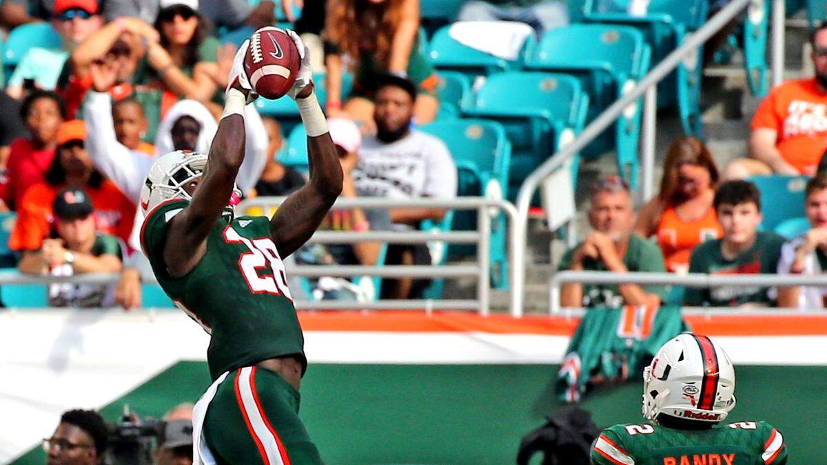 Miami Hurricanes Michael Jackson (28) catches a first quarter interception as they play Syracuse University at Hard Rock Stadium in Miami Gardens, Florida, October 21, 2017.