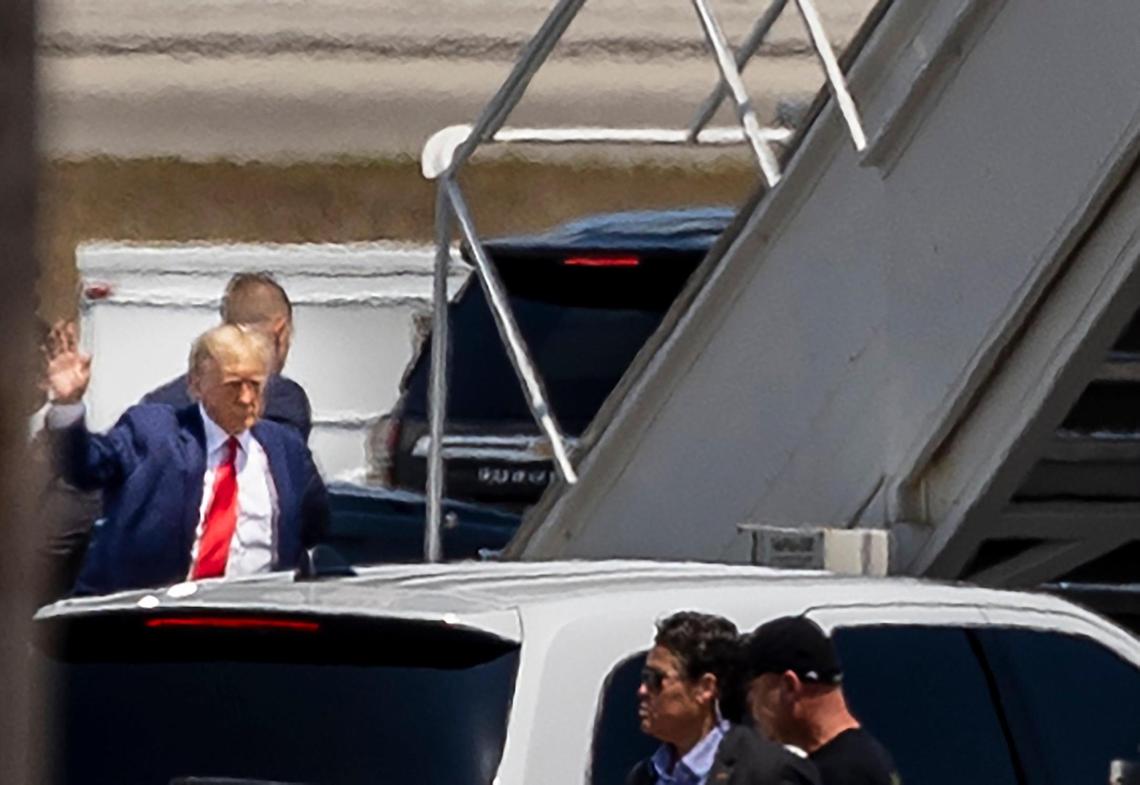 Former President Donald Trump waves as he heads to the stairs to board his private plane at Palm Beach International Airport in West Palm Beach, Florida, on April 3, 2023.