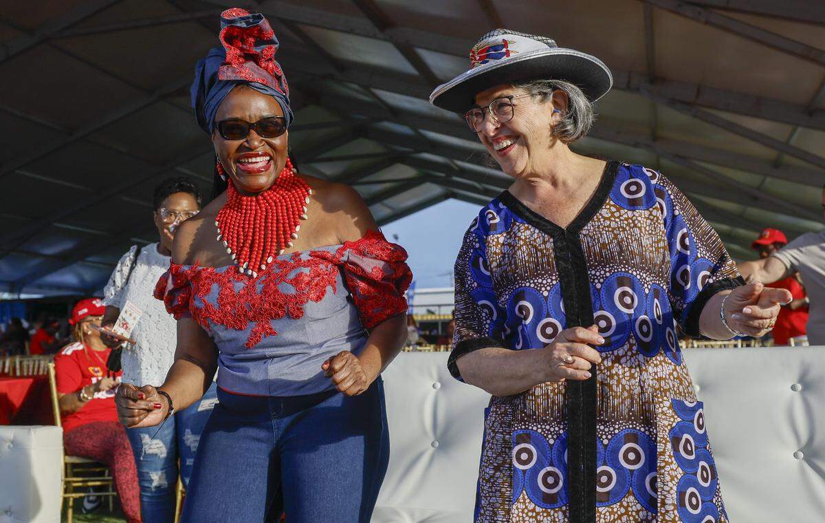 Miami Dade Commissioner Marleine Bastien and Mayor Daniella Levine Cava, left to right, dance to the music during the 28th Annual Haitian Compas Festival at The NoMI Village celebrating Haitian Flag Day, in North Miami, Florida  on Saturday, May 16, 2026.