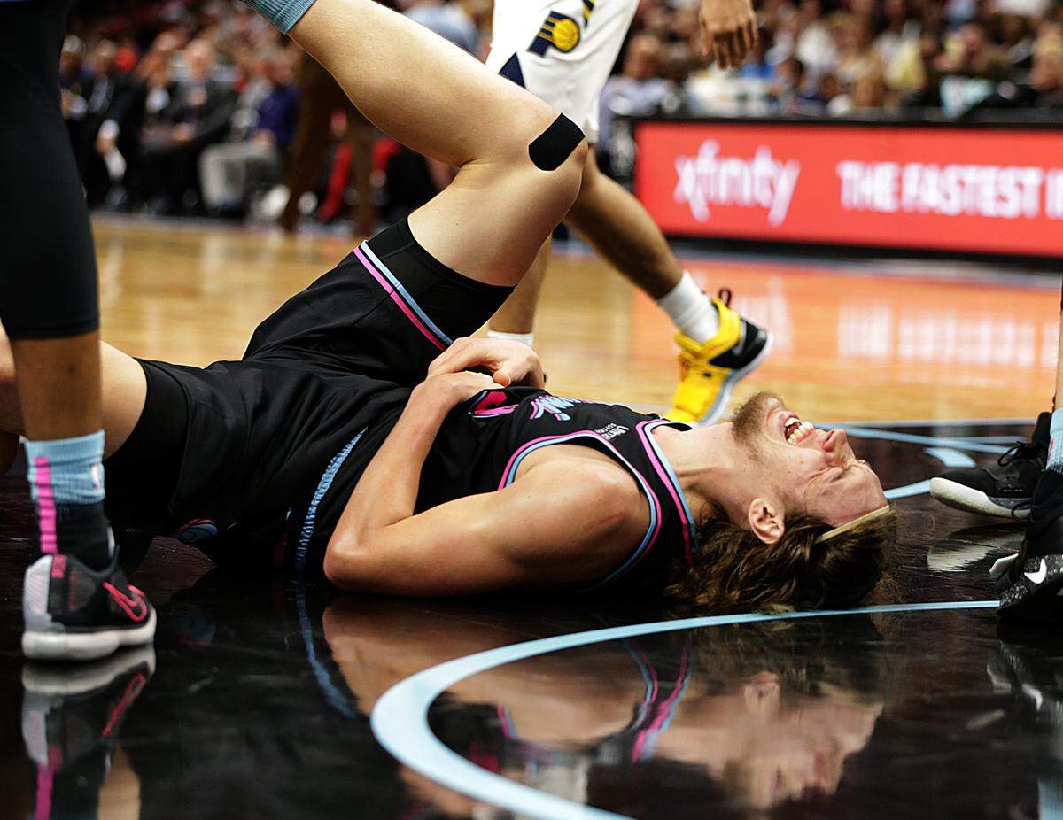 Heat forward Kelly Olynyk reacts after falling down in the the fourth quarter of the Miami Heat vs Indiana Pacers game at AmericanAirlines Arena in Miami on Friday, Nov. 9, 2018.