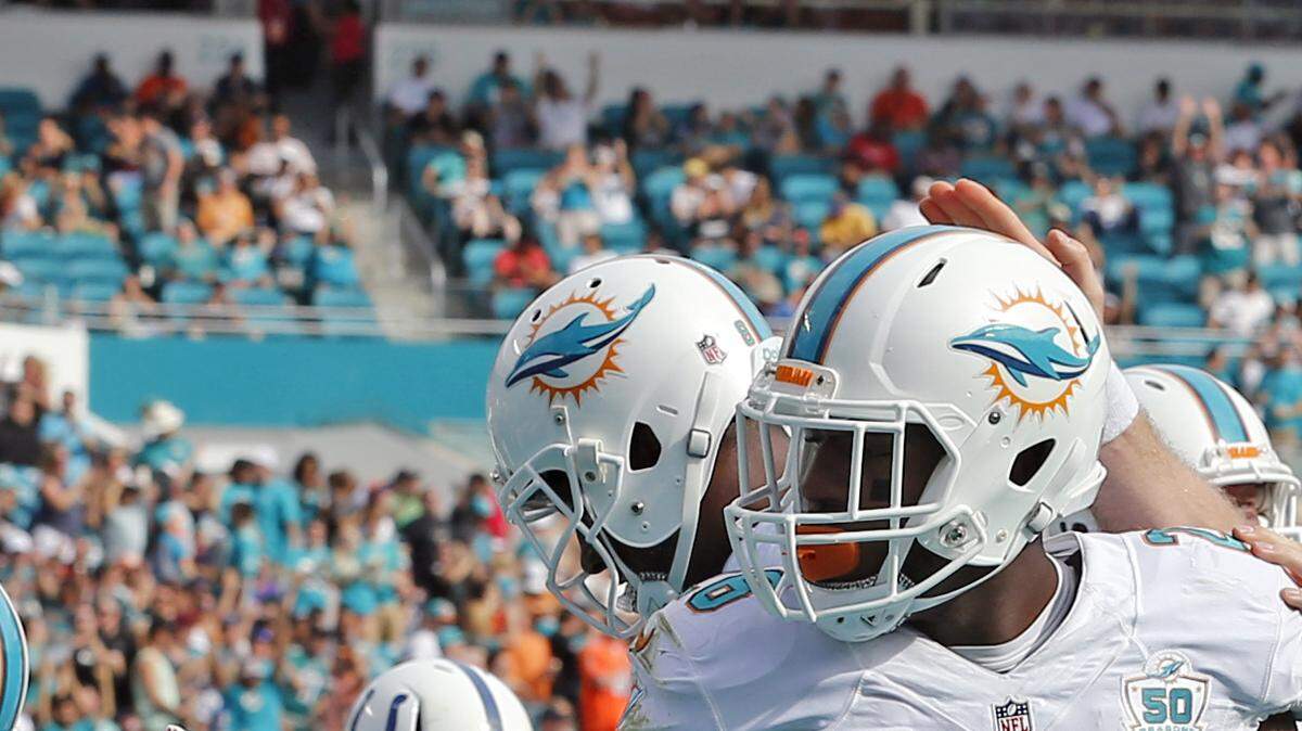 Dolphins quarterback Ryan Tannehill and running back Lamar Miller.