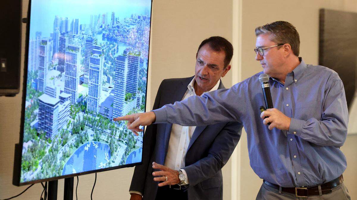 Fort Lauderdale Mayor Dean Trantalis and Director of Development Services Anthony Fajardo go over a drawing of the Galleria mega-project during a town hall meeting at the Coral Ridge Yacht Club on Tuesday, Oct. 28, 2025. 