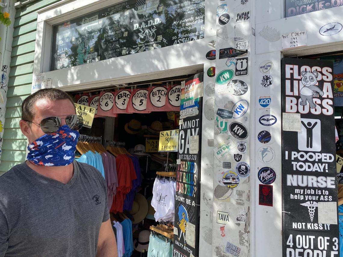 Justin Holt, who co-owns a T-shirt shop in Key West, wears a mask on June 1, 2020.
