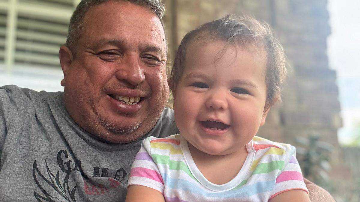 Germán Rodolfo Varela López with his baby niece in his arms.