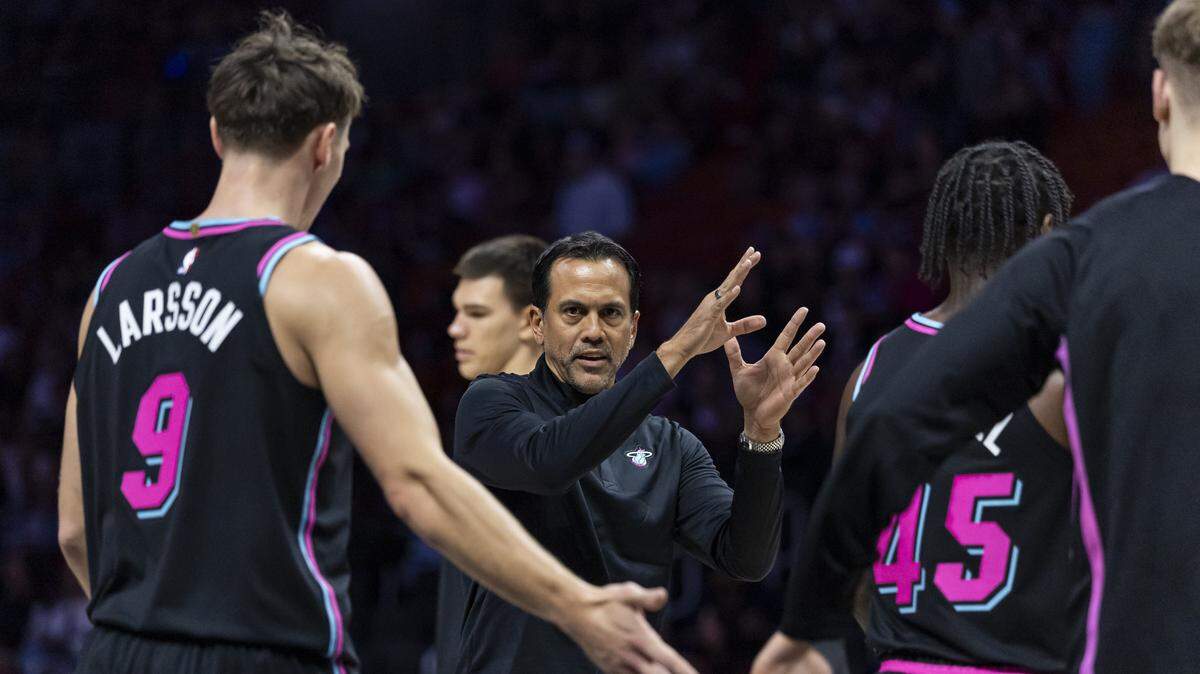 Miami Heat head coach Erik Spoelstra talks with his players during a timeout in the first half of their NBA game against the Cleveland Cavaliers at Kaseya Center on Nov. 12, 2025, in Miami.