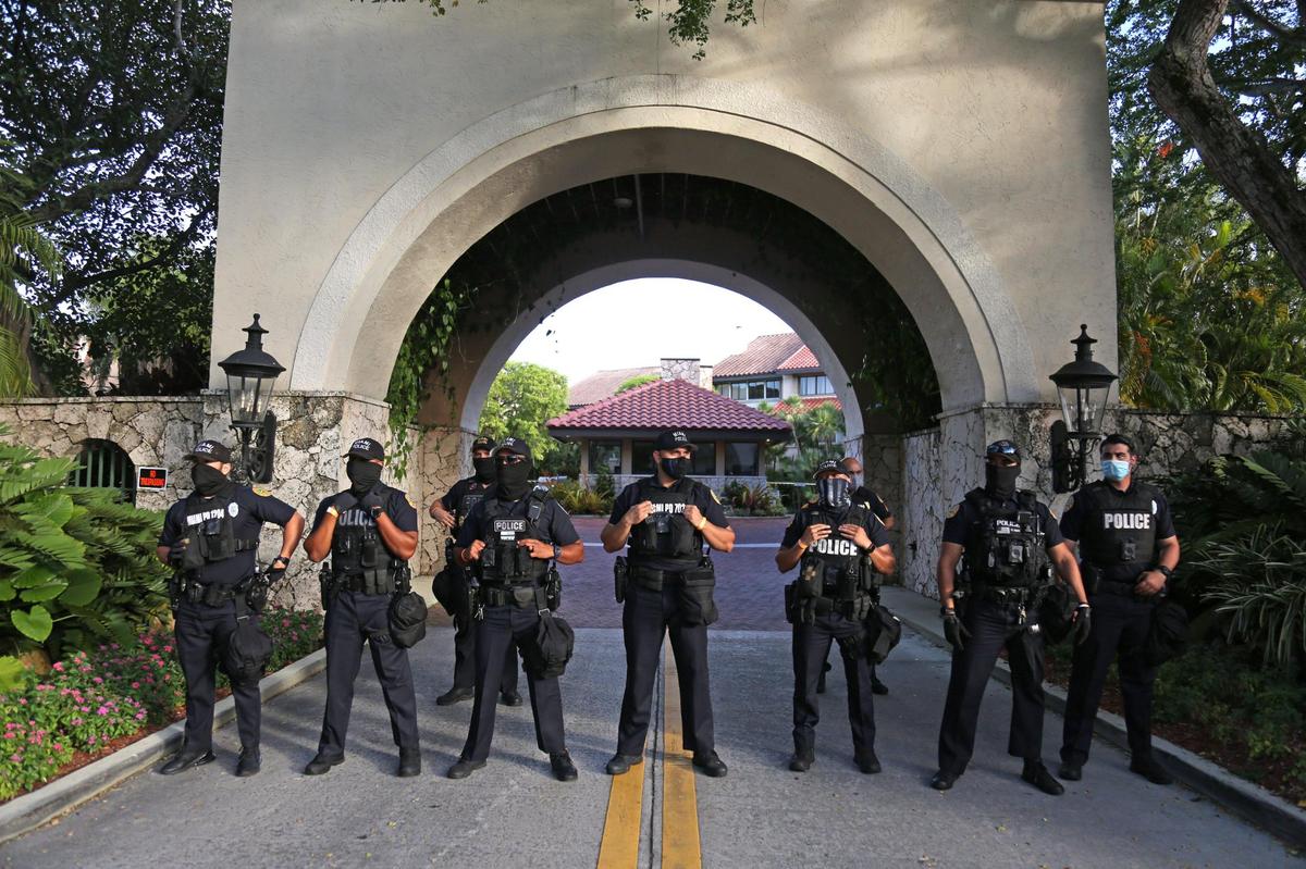 City of Miami police officers guard the entrance to the home of Miami-Dade State Attorney Katherine Fernández Rundle in Coconut Grove last summer as protesters gathered outside demanding she drop all charges against Black Lives Matter demonstrators.