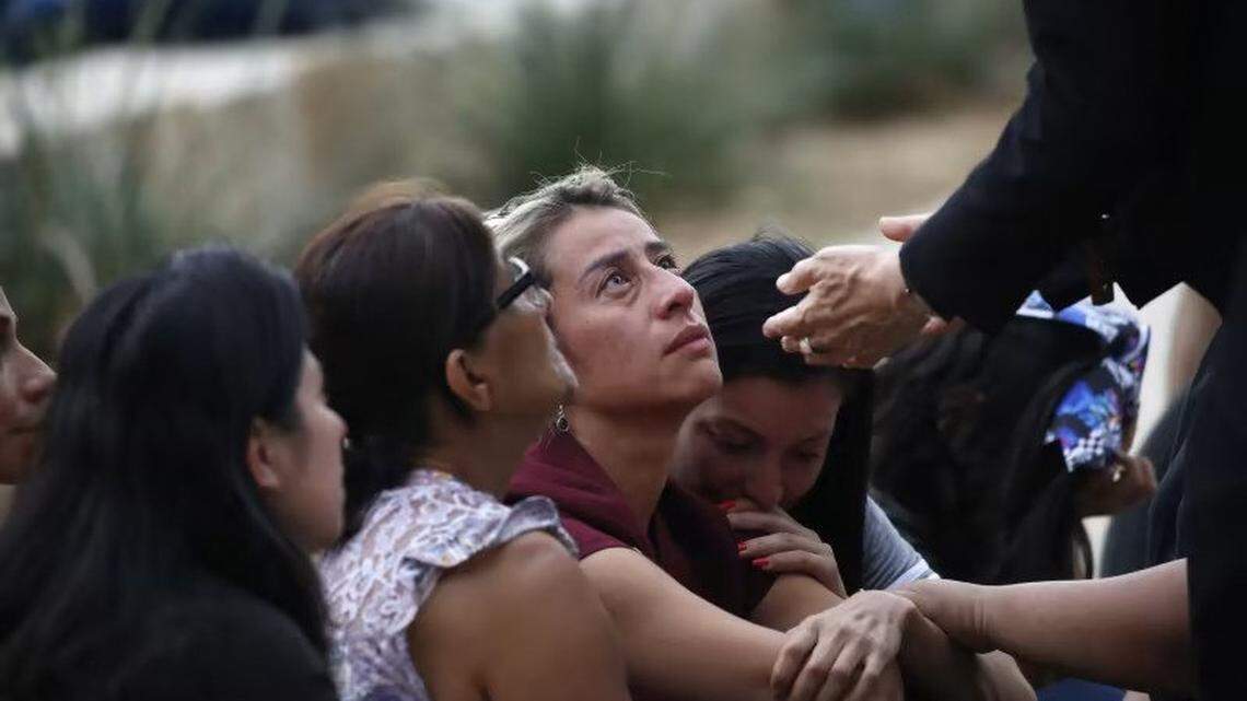 Gustavo Garcia-Siller archbishop of San Antonio, comforts families outside of the Civic Center in Uvalde, Texas.