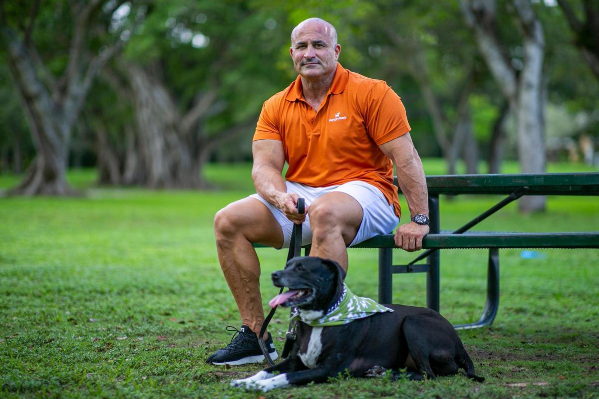 Nick Molina, the founder of Hungry Bark, visits Dante Fascell Park in Miami with his dog, Shorty, on Tuesday, Oct. 6, 2020. Molina’s startup is designed to help dogs reach their peak performance by personalizing dog food for them.