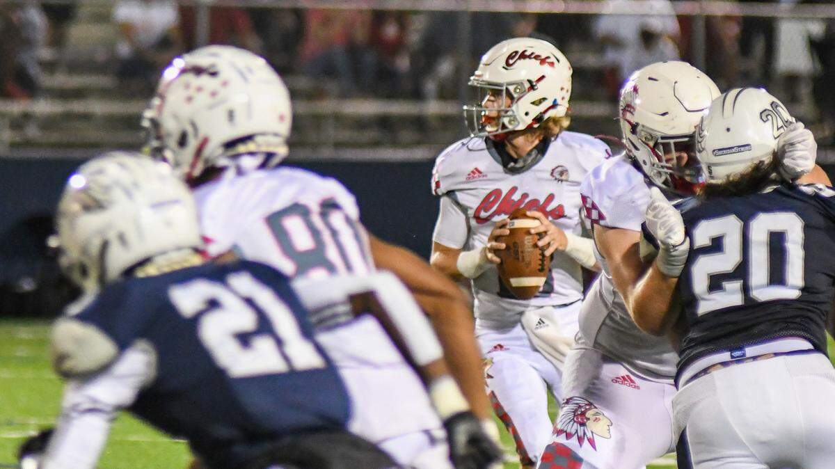 Cardinal Gibbons quarterback Mason Polivka drops back to pass against Delray American Heritage in the Region 4-4A finals on Friday, Nov. 27, 2020.