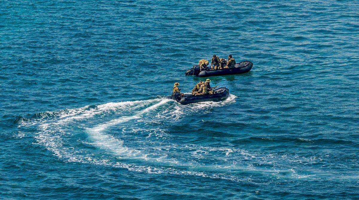 Members of the U.S. Army Special Operations Command (Airborne) train in the waters off South Beach ahead of the Hyundai Air & Sea Show, part of Miami Beach’s annual National Salute to America’s Heroes, on Friday, May 23, 2025.