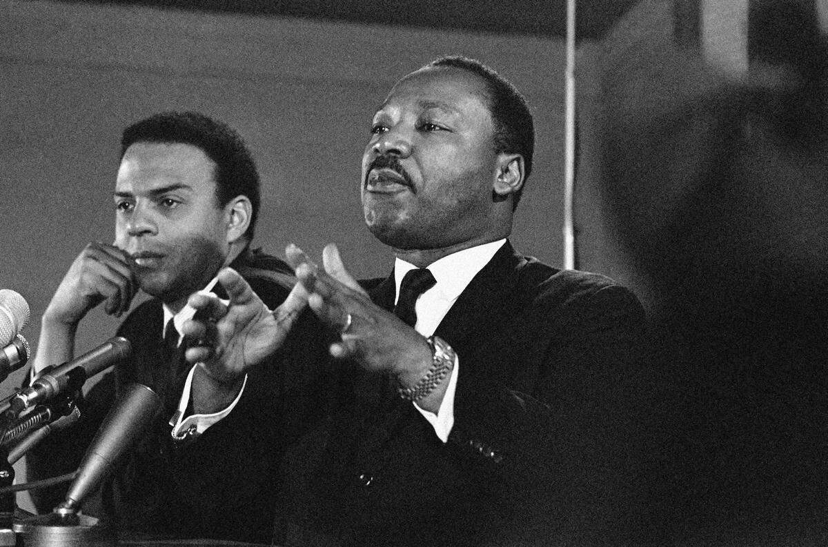In this Feb. 7, 1968, file photo, Dr. Martin Luther King Jr., center, speaks to an audience while promising a massive demonstration in the spring in Washington and hinting the crusade may be extended to the political party conventions in August. King, president of the Southern Christian Leadership Conference, said the demonstration in Washington would last for weeks and maybe for months. At left is the Rev. Andrew Young, executive vice president of the Southern Conference. Veterans of past social movements, such as Young, say the Occupy Wall Street protest has been a welcome response to the abysmal economy and has the potential to galvanize wide support, but whether it will lead to lasting political change remains to be seen. “There’s a difference between an emotional outcry and a movement,” said Young, who worked alongside King as a strategist during the civil rights movement. “This is an emotional outcry. The difference is organization and articulation.”