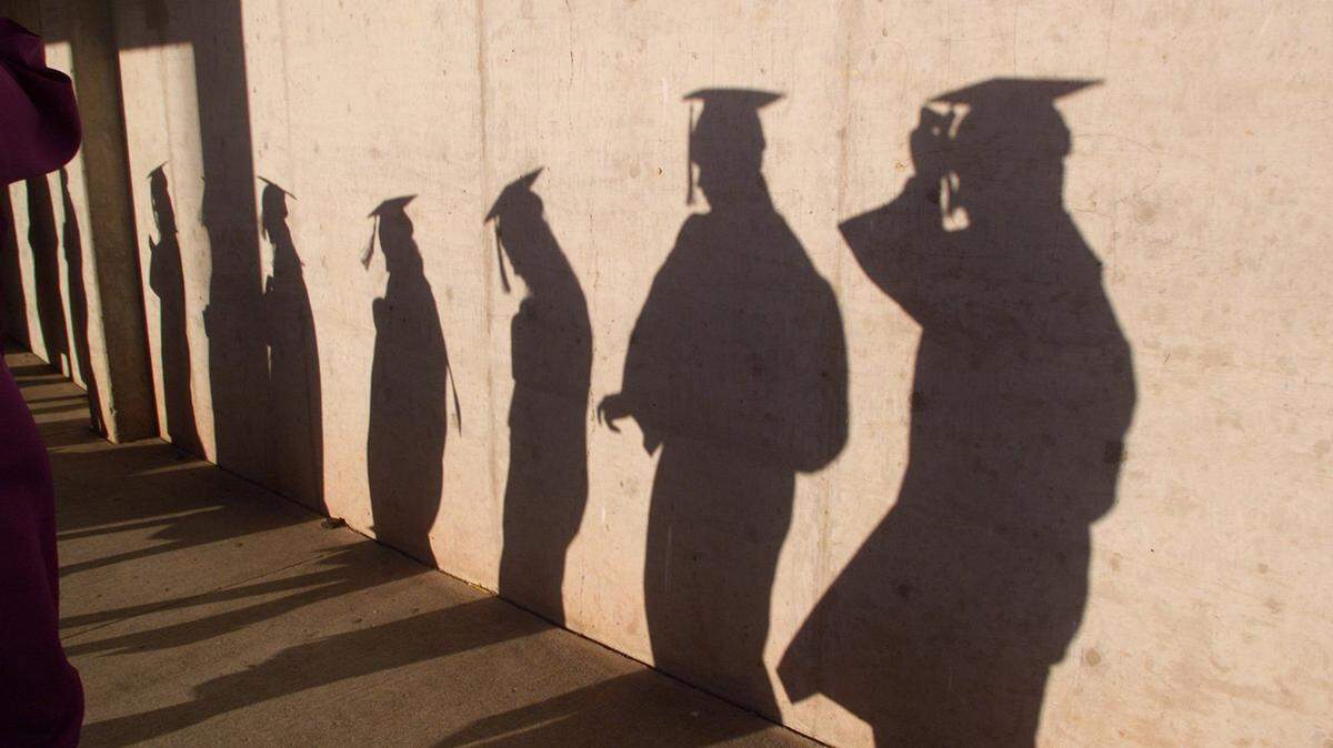 High school students line up just before their graduation ceremony.