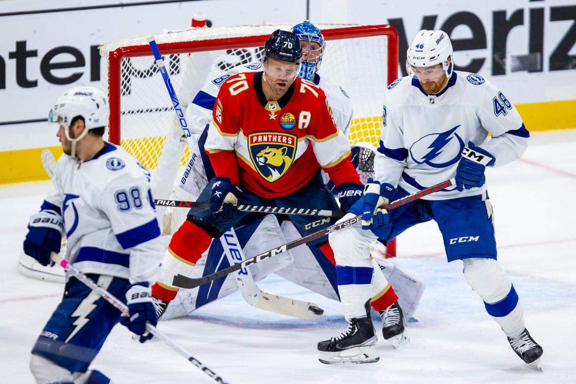 Florida Panthers right wing Patric Hornqvist (70) blocks Tampa Bay Lightning goalie Andrei Vasilevskiy (88) while defender Nick Perbix (48) attempts to deflect the shot during an NHL game at FLA Live Arena in Sunrise, Florida, on Friday, October 21, 2022.