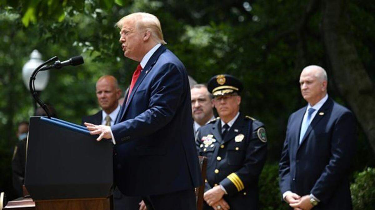President Trump speaks at the event where he signed an executive order on police reform in the Rose Garden of the White House.