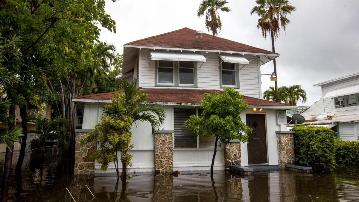 Water rises. A house’s front lawn is submerged under floodwaters off Southwest Third Street and Eighth Avenue in Little Havana in 2022. 