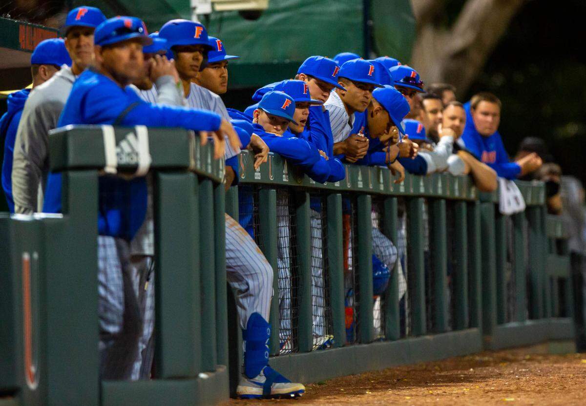 The Florida Gators are shown after the Miami Hurricanes scored three runs on a home run during the first inning of a baseball game against University of Florida at Alex Rodriguez Park in Coral Gables, Florida on Friday, February 21, 2020.