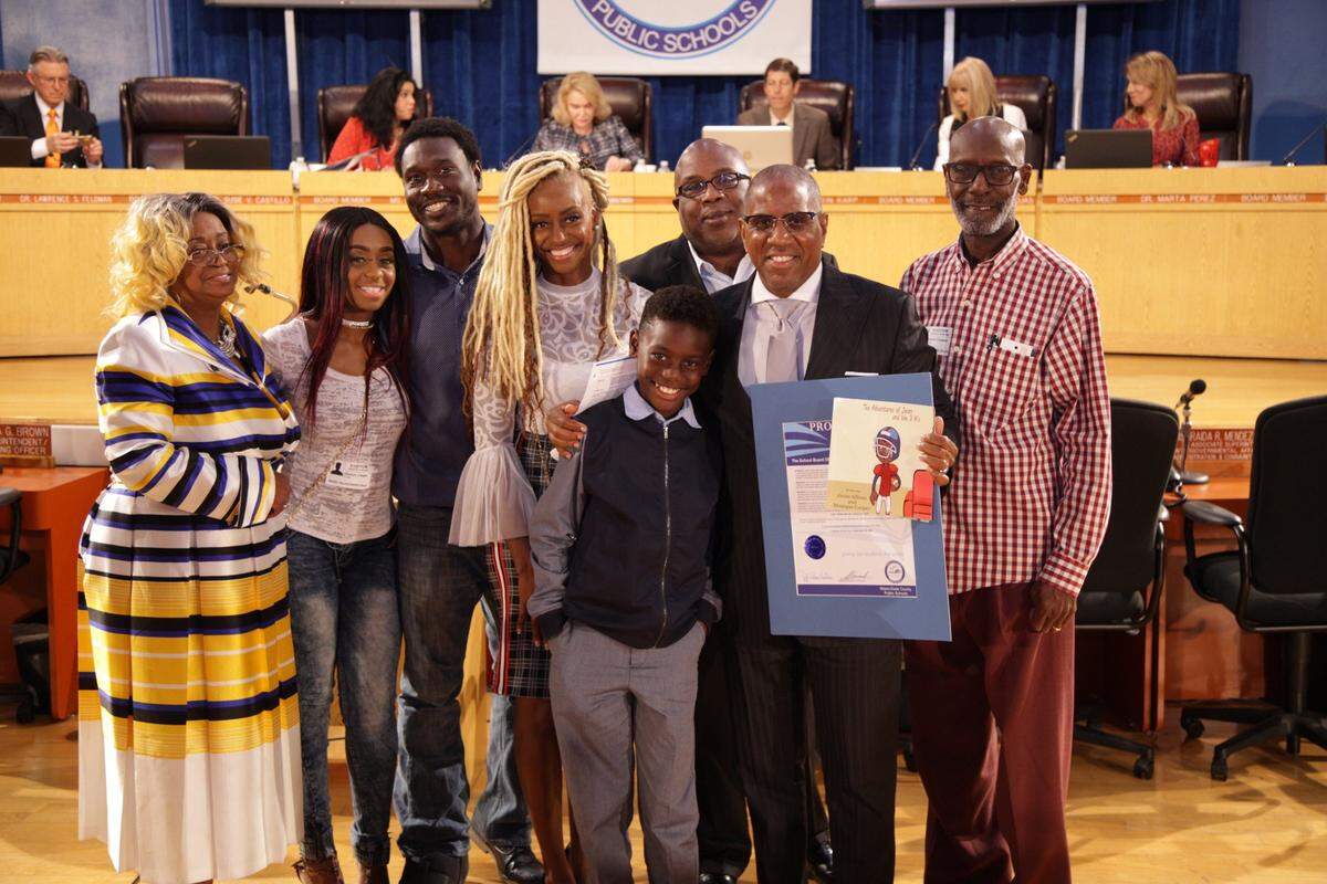 Javan Allison of Norwood Elementary School, center, with his family and friends after being recognized for authoring his first children’s book titled “#Asthmasucks,” the first of his three-book series “The Adventures of Javan and the 3 A’s.”